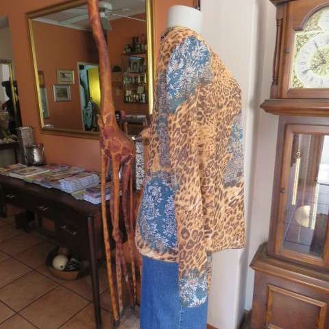 Fabulous slip over long sleeve top in brown animal print and blue lace print. Size 40/16 CASUAL CLUB