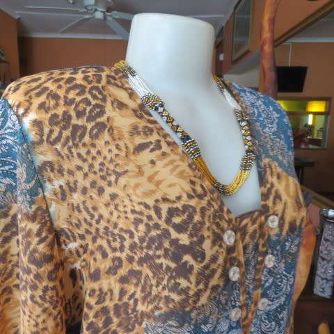Fabulous slip over long sleeve top in brown animal print and blue lace print. Size 40/16 CASUAL CLUB