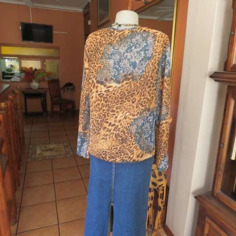 Fabulous slip over long sleeve top in brown animal print and blue lace print. Size 40/16 CASUAL CLUB