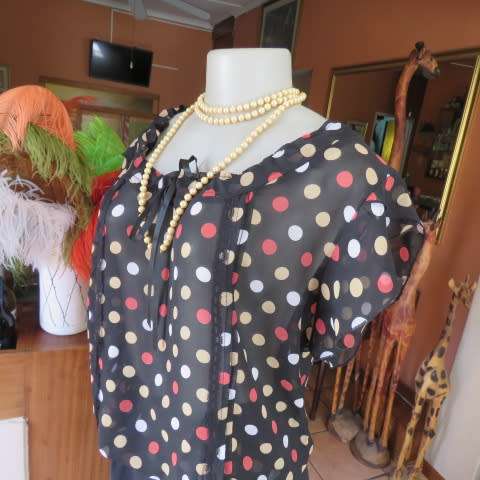 Cool black summer blouson slip over top with polkadots in size 38/14 by MASSUMI.Drawstring neckline