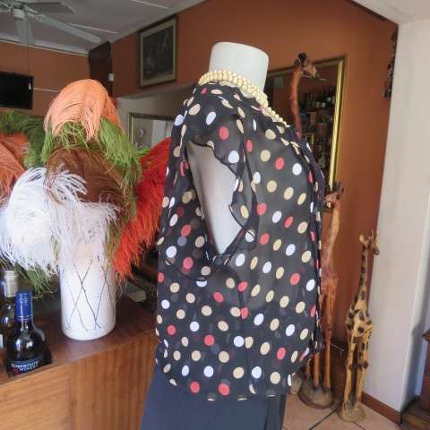 Cool black summer blouson slip over top with polkadots in size 38/14 by MASSUMI.Drawstring neckline