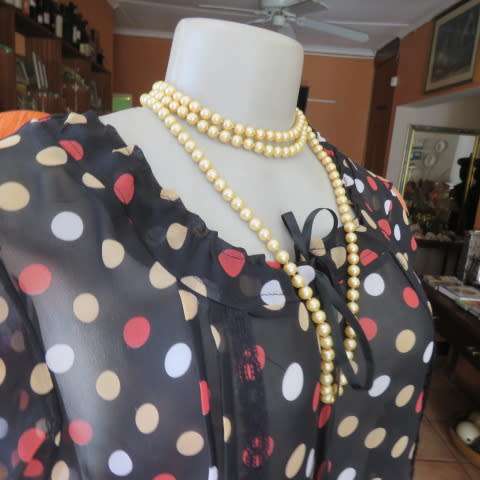 Cool black summer blouson slip over top with polkadots in size 38/14 by MASSUMI.Drawstring neckline
