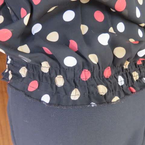 Cool black summer blouson slip over top with polkadots in size 38/14 by MASSUMI.Drawstring neckline