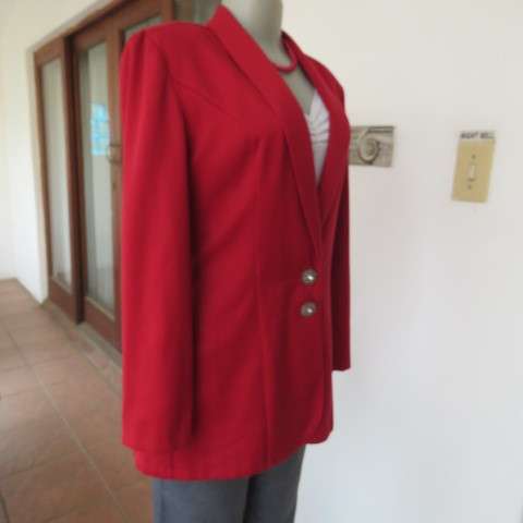 Show stopping red peacoat style long sleeve jacket closing with 2 buttons. Pleats at back.Size 34/10