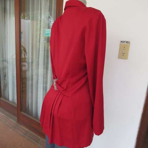 Show stopping red peacoat style long sleeve jacket closing with 2 buttons. Pleats at back.Size 34/10