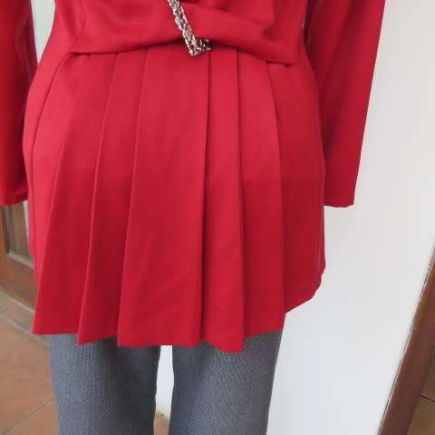 Show stopping red peacoat style long sleeve jacket closing with 2 buttons. Pleats at back.Size 34/10