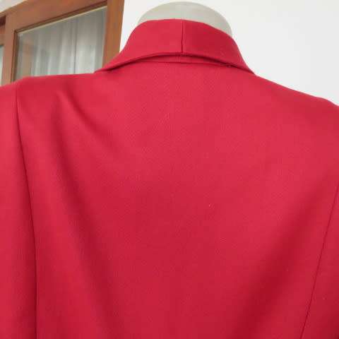 Show stopping red peacoat style long sleeve jacket closing with 2 buttons. Pleats at back.Size 34/10