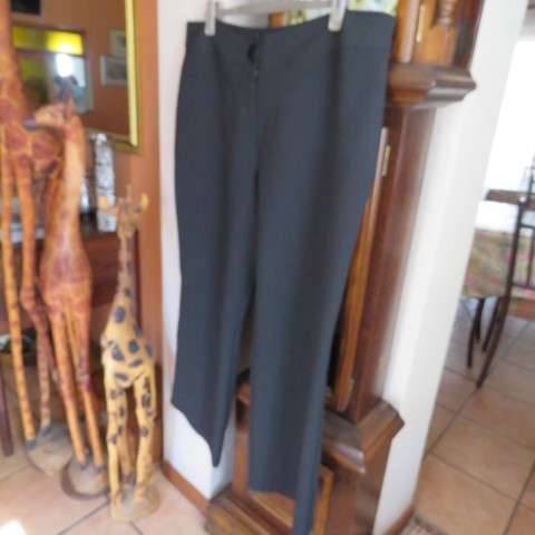 As new black straight legged pants in 100% polyester by DONNA-CLAIRE in size 46/22