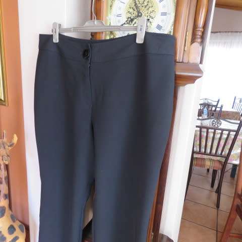As new black straight legged pants in 100% polyester by DONNA-CLAIRE in size 46/22