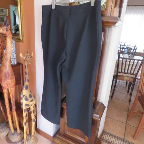 As new black straight legged pants in 100% polyester by DONNA-CLAIRE in size 46/22