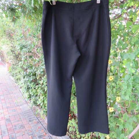 As new black straight legged pants in 100% polyester by DONNA-CLAIRE in size 46/22