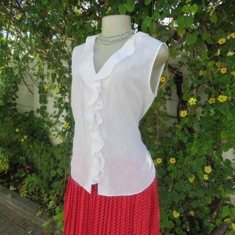 Dainty white sleeveless frilled top in sheer embroidered polyester. Size 36 By WOOLWORTHS.As new.