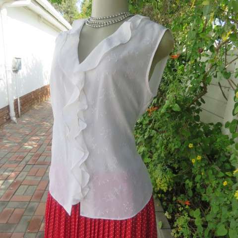 Dainty white sleeveless frilled top in sheer embroidered polyester. Size 36 By WOOLWORTHS.As new.