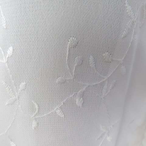 Dainty white sleeveless frilled top in sheer embroidered polyester. Size 36 By WOOLWORTHS.As new.