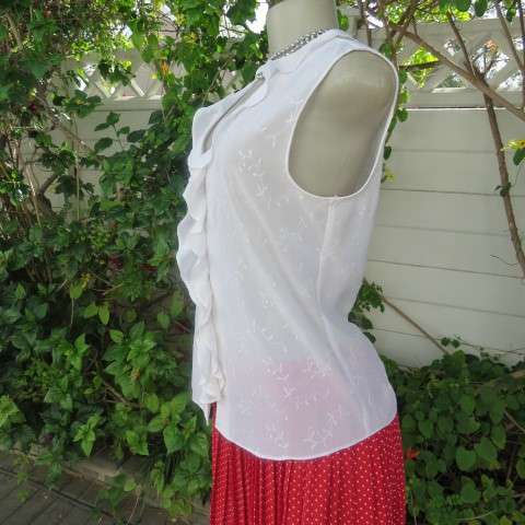 Dainty white sleeveless frilled top in sheer embroidered polyester. Size 36 By WOOLWORTHS.As new.