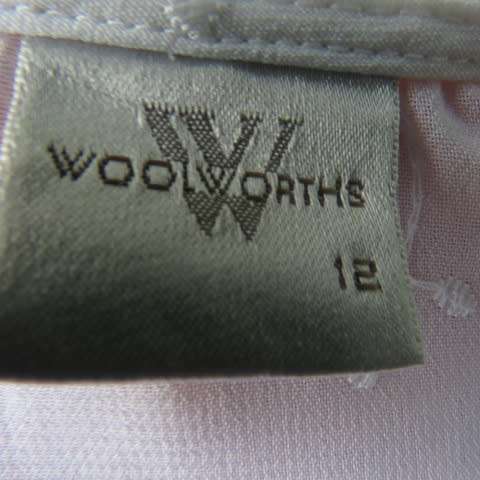 Dainty white sleeveless frilled top in sheer embroidered polyester. Size 36 By WOOLWORTHS.As new.
