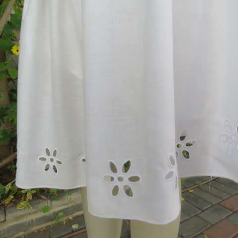 White fine cotton skirt with yoke and gathered bottom with lining, Embroidered border.Size 36/12
