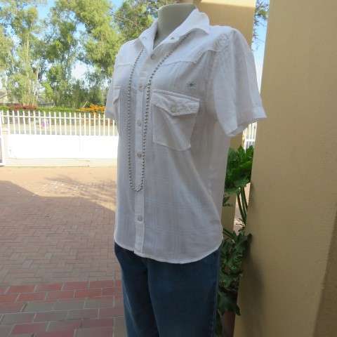 Casual white short sleeve top closing with press buttons. Size 36/12 by RT. Cowboy yokes.As new