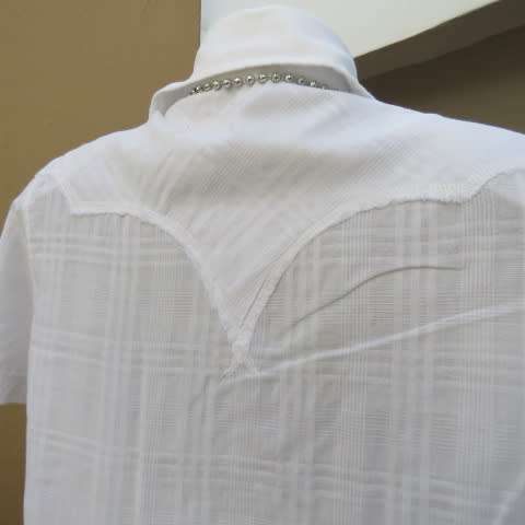 Casual white short sleeve top closing with press buttons. Size 36/12 by RT. Cowboy yokes.As new