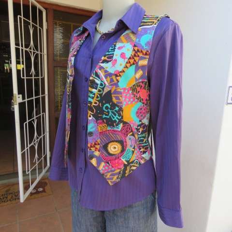 Funky waistcoat in medley of colours and patterns and black back. Size 34/10. New condition.