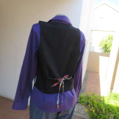 Funky waistcoat in medley of colours and patterns and black back. Size 34/10. New condition.