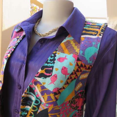 Funky waistcoat in medley of colours and patterns and black back. Size 34/10. New condition.