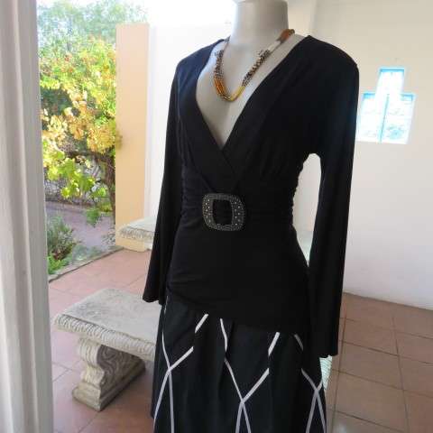 Fabulous used black sexy long sleeve top from IQ in size 38/14.Low plunging neckline.Front buckle