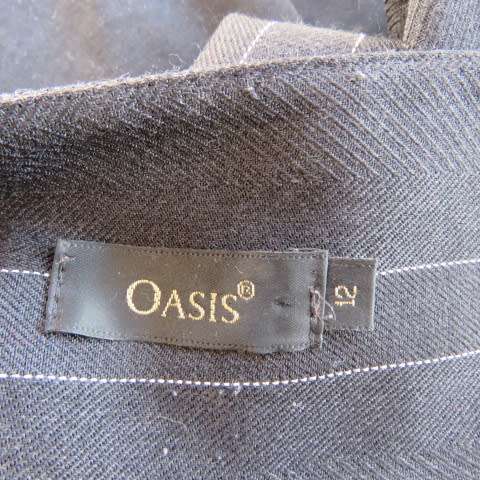 Elegant black pants with thin white vertical stripes by OASIS in size 36/12. Large size. As new