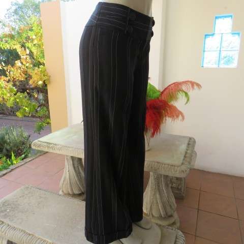 Elegant black pants with thin white vertical stripes by OASIS in size 36/12. Large size. As new