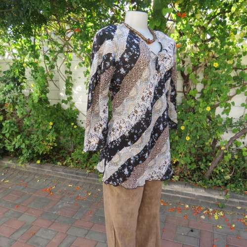 Diagonal floral patterned long sleeve top in brown,black and light blue. Size 36/12 by MICHAELA.