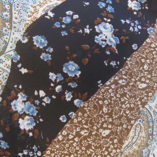 Diagonal floral patterned long sleeve top in brown,black and light blue. Size 36/12 by MICHAELA.