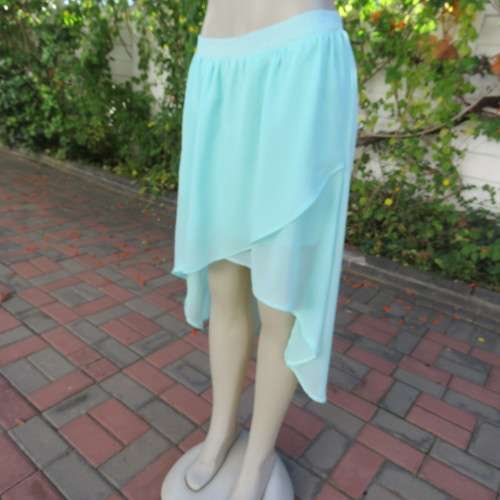 Sexy pale turquoise asymetric skirt with fold over front. Size 36/12. Sheer polyester partly lined.
