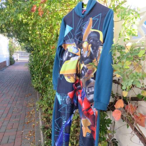 Onesie in blue with Transformers print on front. Zip on front. Hooded. For 12 to 13 year old boy.