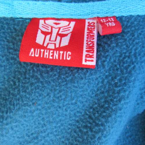 Onesie in blue with Transformers print on front. Zip on front. Hooded. For 12 to 13 year old boy.