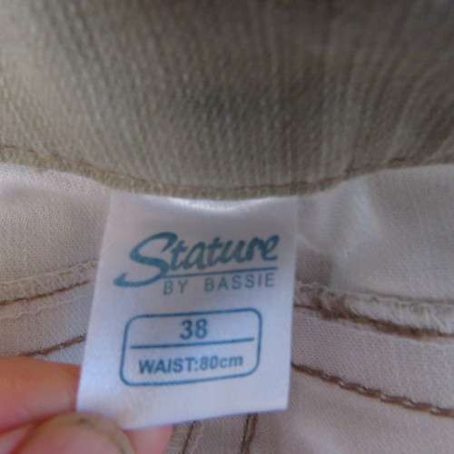 Casual dark beige ankle pants with turnovers in size 38/14 by STATURE.In firm stretch cotton. As new