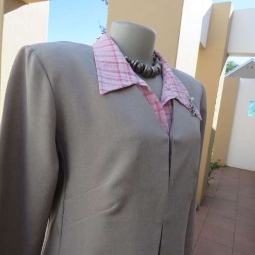 As new long vintage jacket in pale grey 100% polyester .V collarless neckline.Size 36/12 by TOPICS