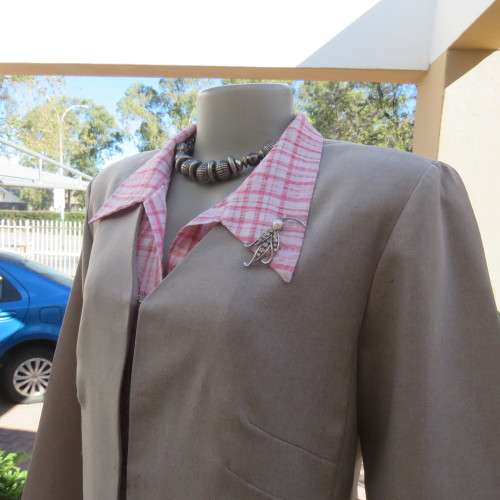 As new long vintage jacket in pale grey 100% polyester .V collarless neckline.Size 36/12 by TOPICS