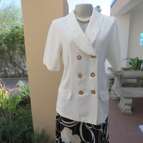 Very smart and elegant size 34/10 double breast cream top with pretty embroidery and lace decoration