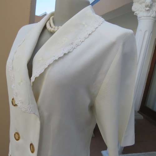 Very smart and elegant size 34/10 double breast cream top with pretty embroidery and lace decoration