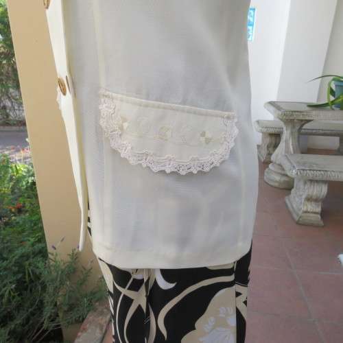 Very smart and elegant size 34/10 double breast cream top with pretty embroidery and lace decoration