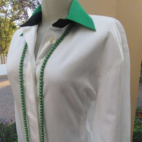 As new long sleeve soft 100% cotton shirt with green and black shirt collar and cuffs. Size 38/14