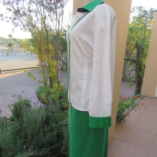 As new long sleeve soft 100% cotton shirt with green and black shirt collar and cuffs. Size 38/14
