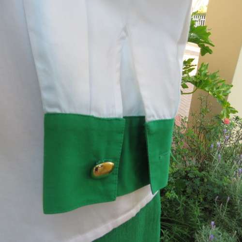 As new long sleeve soft 100% cotton shirt with green and black shirt collar and cuffs. Size 38/14