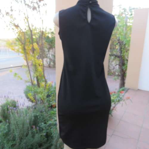 The little black dress! Size 34/10 by IQ Smart clothes.Stretch textured polyester.New condition.