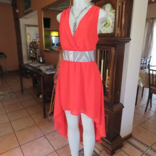 Sexy bright red sheer polyester dress with lining. Mini length on front size 38/14. Good condition.