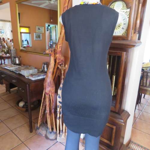 Knitted black long top/dress.Low  U neckline.Sleeveless size 34/10 by `RT`.Two cute pockets.As new!