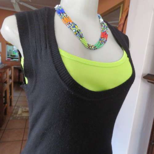Knitted black long top/dress.Low  U neckline.Sleeveless size 34/10 by `RT`.Two cute pockets.As new!