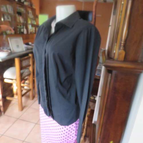 Timeless black long sleeve shirt by 'Woolworths' in size 38/14. Cuffed sleeves. In 100% cotton.