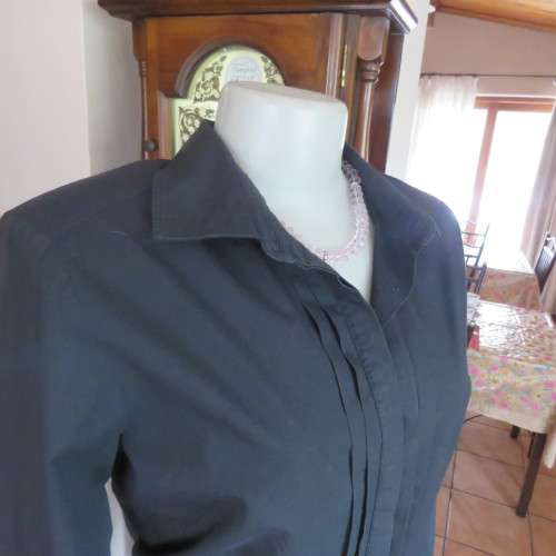 Timeless black long sleeve shirt by 'Woolworths' in size 38/14. Cuffed sleeves. In 100% cotton.