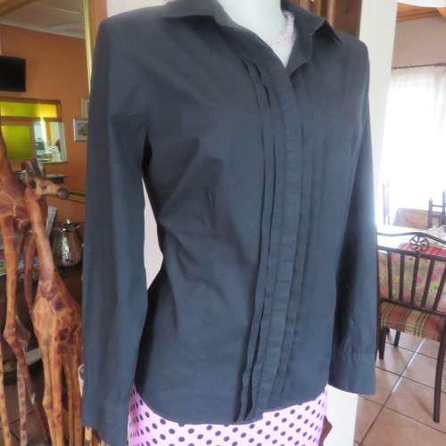 Timeless black long sleeve shirt by 'Woolworths' in size 38/14. Cuffed sleeves. In 100% cotton.